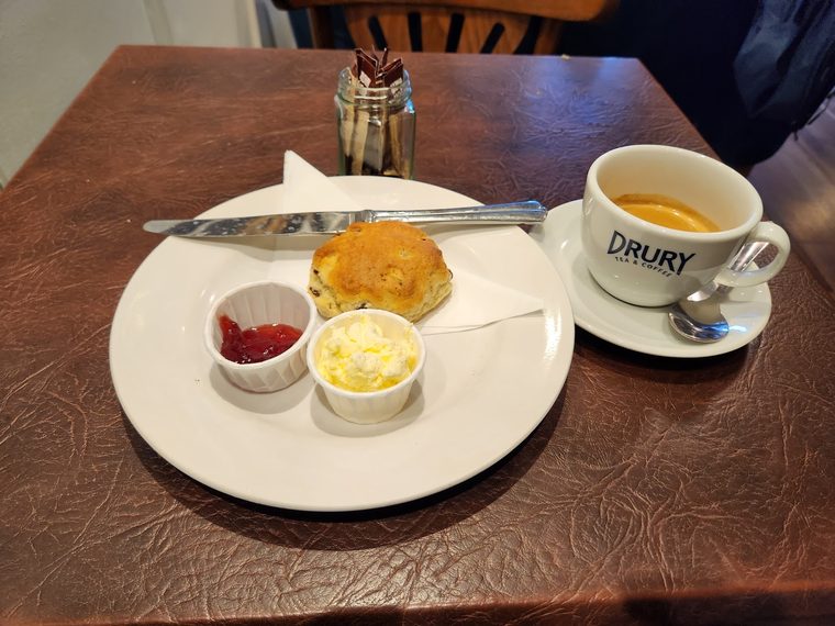 A potato croquette with ketchup and mayonnaise